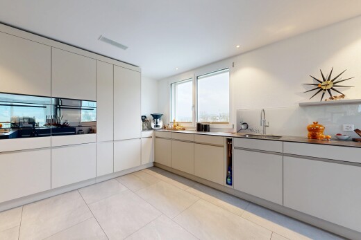 kitchen with modern cabinets, light tile patterned floors, and recessed lighting