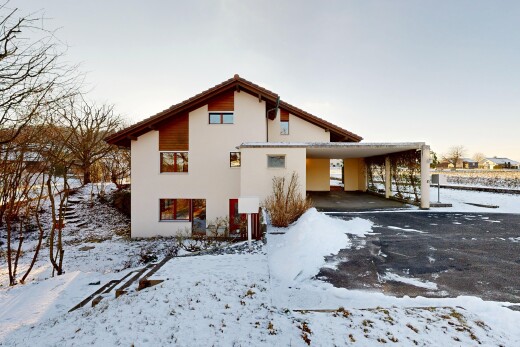 außenansicht mit carport angeschlossen, property visible, und stuckverkleidung