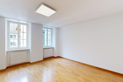 leerer raum mit kühler, holzfußboden, wood finish floor, gipskartonwand, und drywall