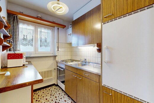kitchen featuring wood finish cabinets, stainless steel appliances, tasteful backsplash, open shelves, and light countertops