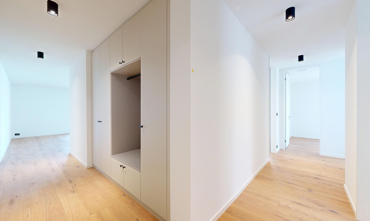 hallway with light wood-type flooring