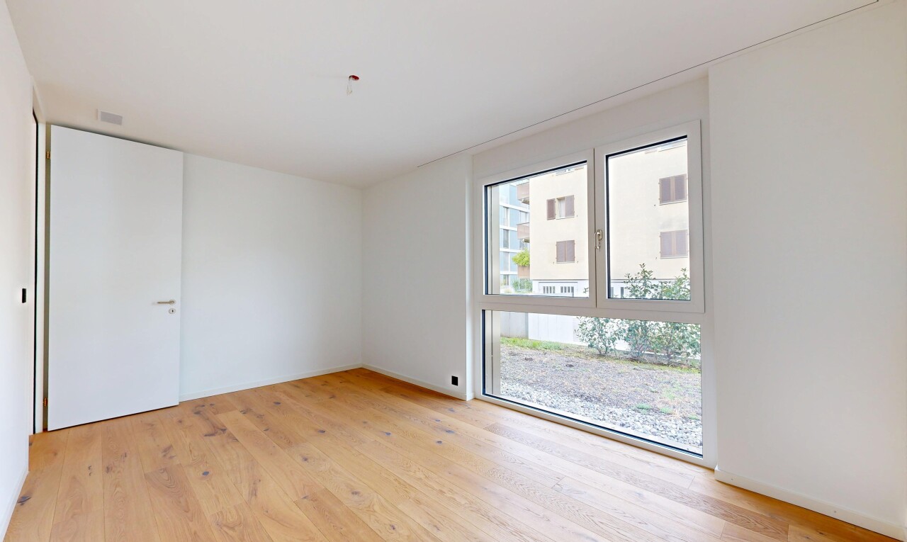 spare room with light wood-type flooring