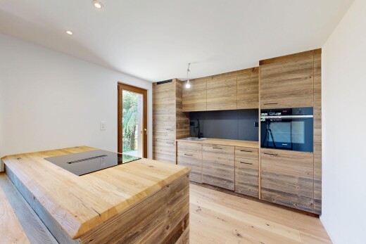 cuisine avec cloison sèche, drywall, four, flat panel cabinets, et armoires à panneau plat