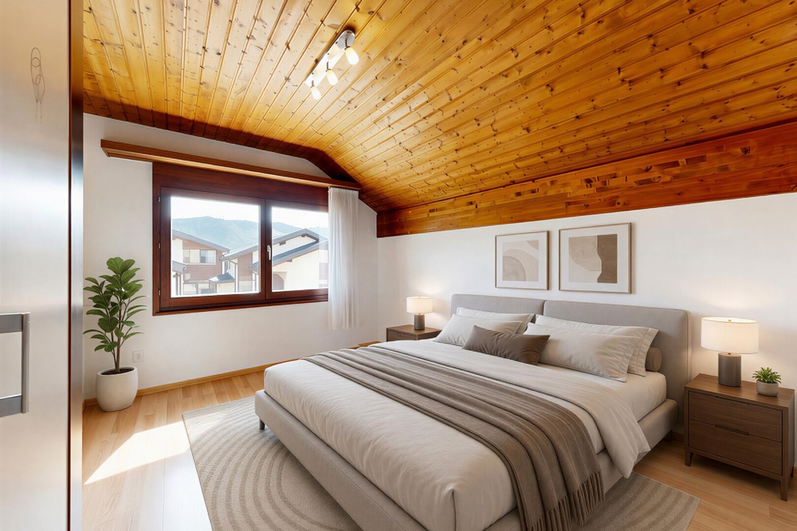 chambre avec éclairage sur rail, vaulted ceiling, plafond voûté, drywall, et cloison sèche