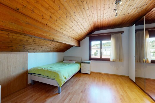 room featuring rail lighting, a vaulted wood ceiling, light wood-style floors, and a closet