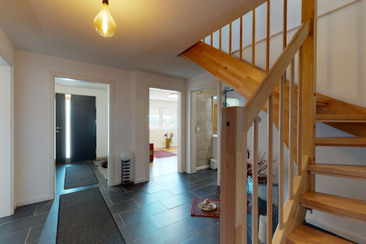 staircase featuring tile floors