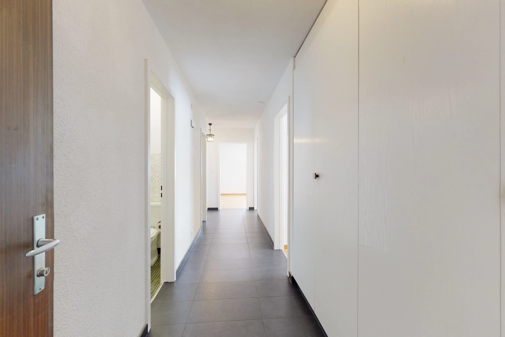 hallway featuring tile floors