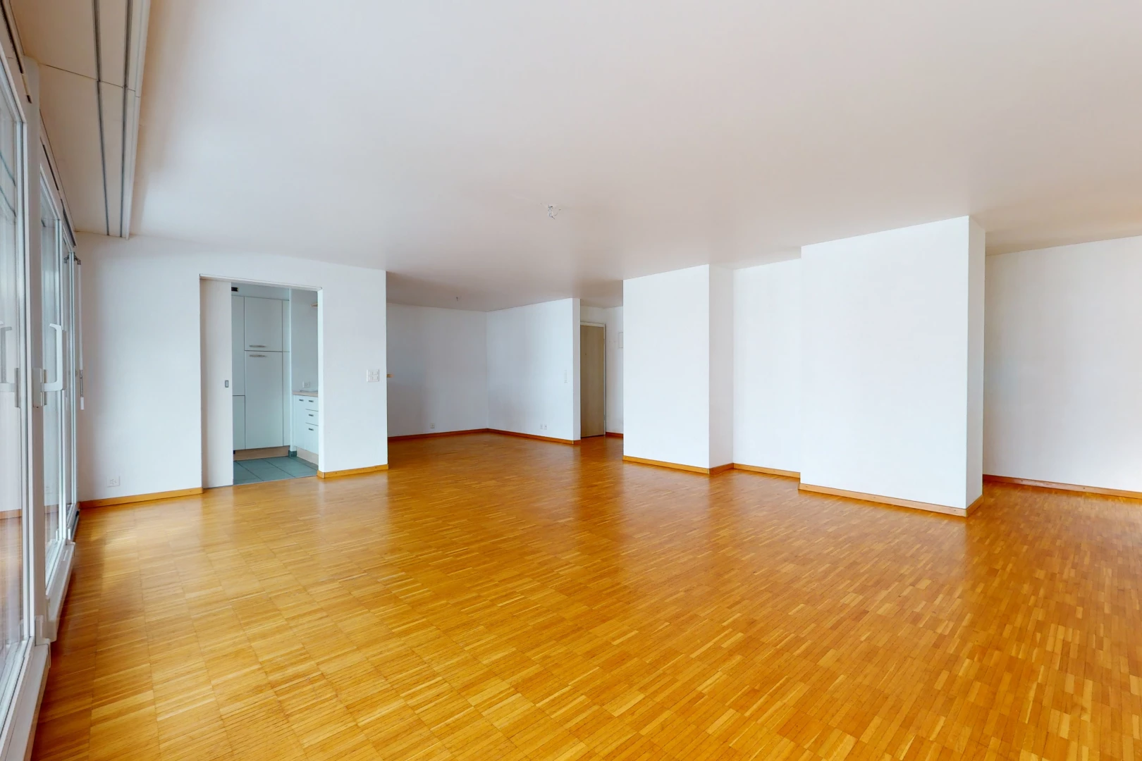 view of hardwood floored empty room