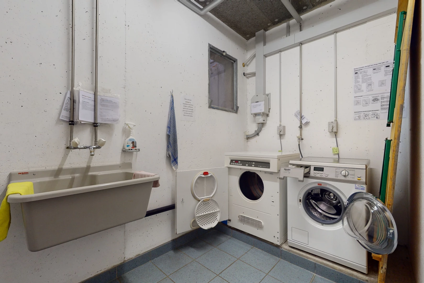 washroom with tile floors and washer / dryer