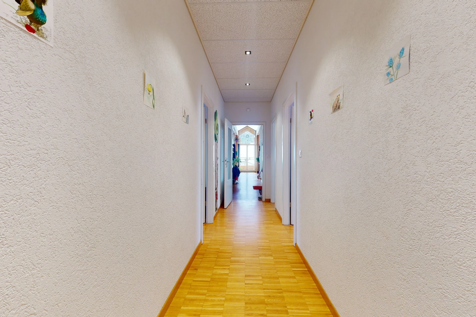 hallway with wood-type flooring