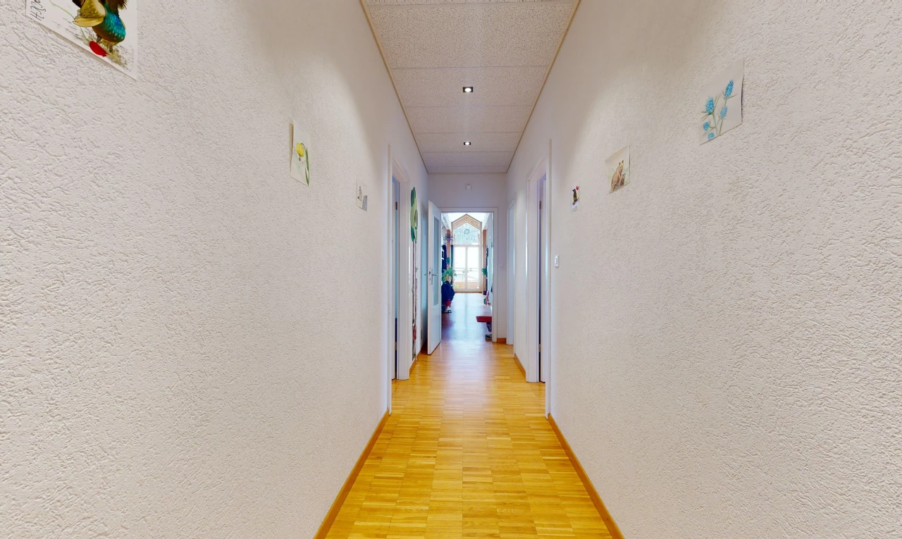 hallway with wood-type flooring