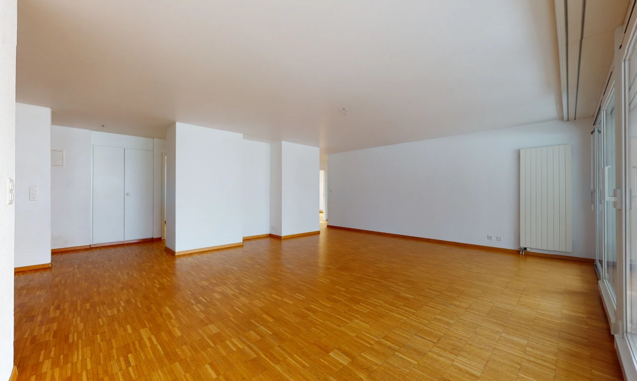bonus room featuring wood-type flooring and radiator