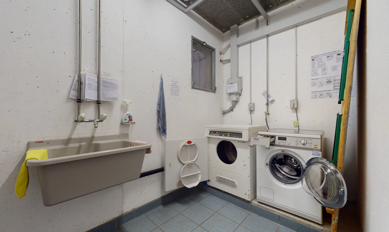 washroom with tile floors and washer / dryer