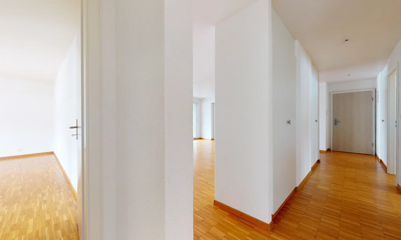 hallway with hardwood flooring