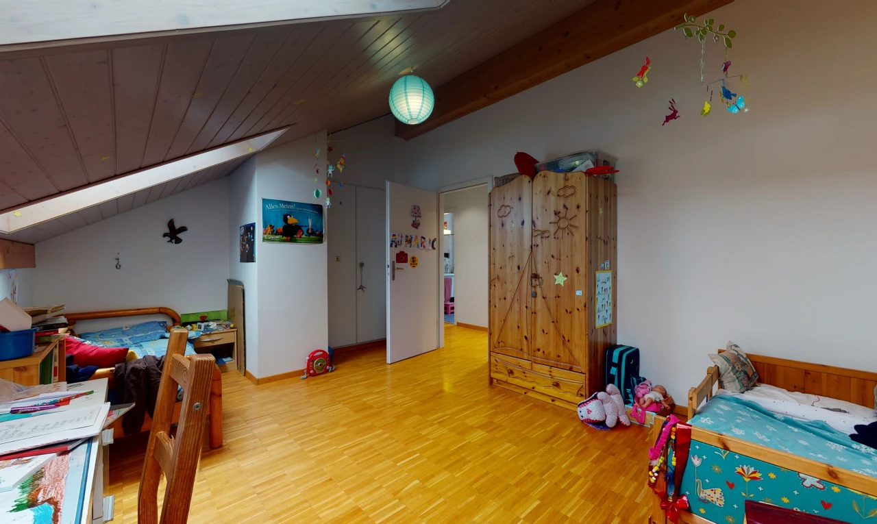 playroom with wood-type flooring and lofted ceiling