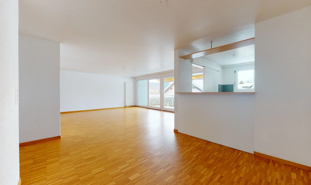 wood floored spare room with natural light