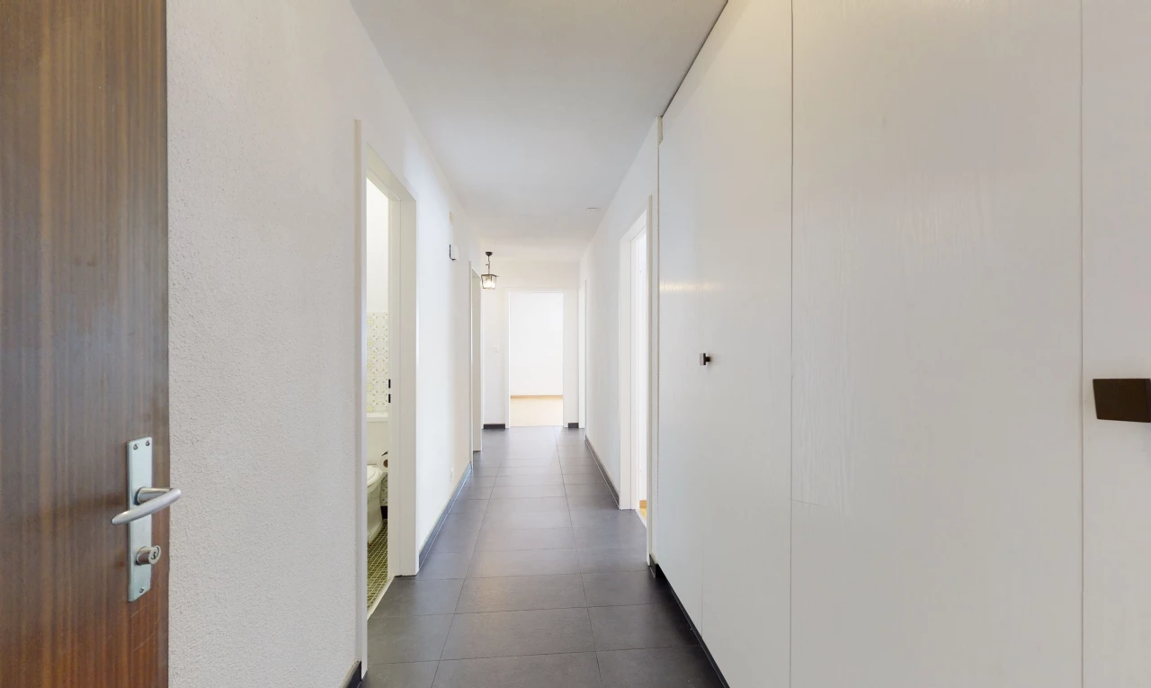 hallway featuring tile floors