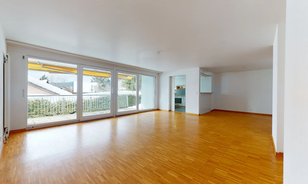 wood floored spare room with natural light