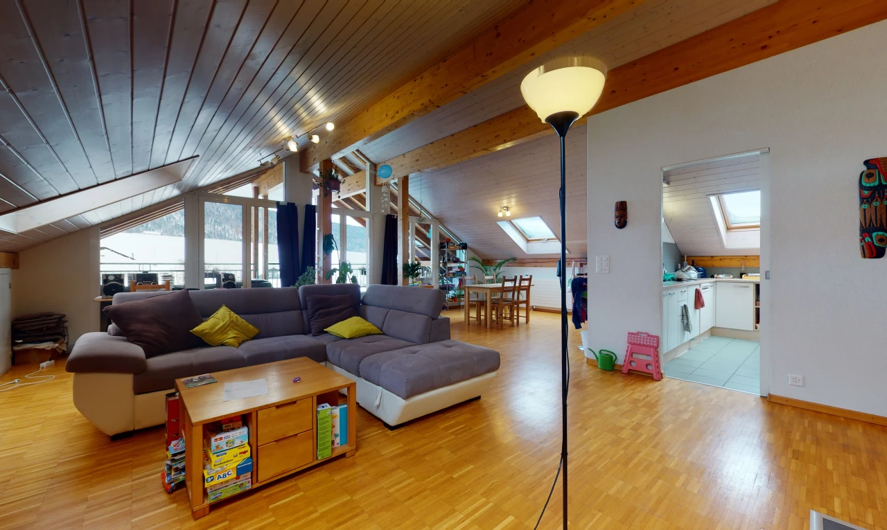 living room featuring natural light, wood beam ceiling, and tile floors