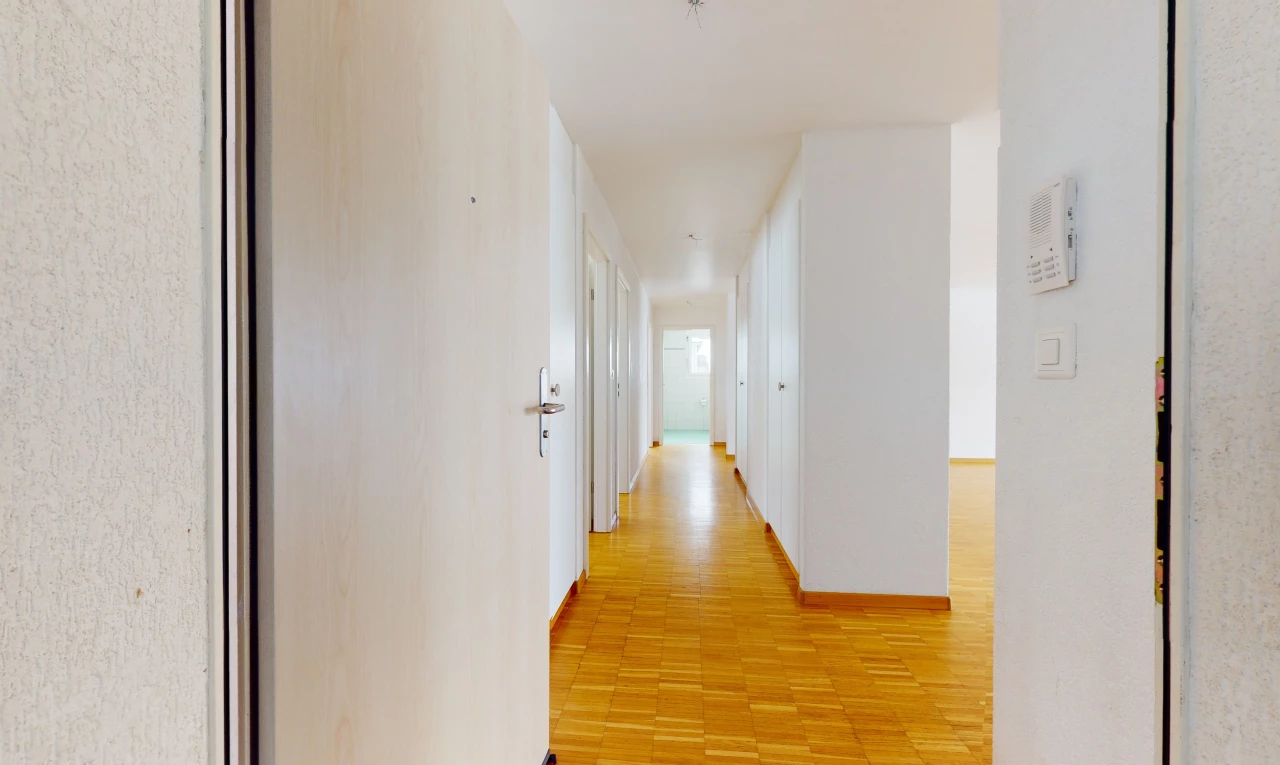 corridor with hardwood floors