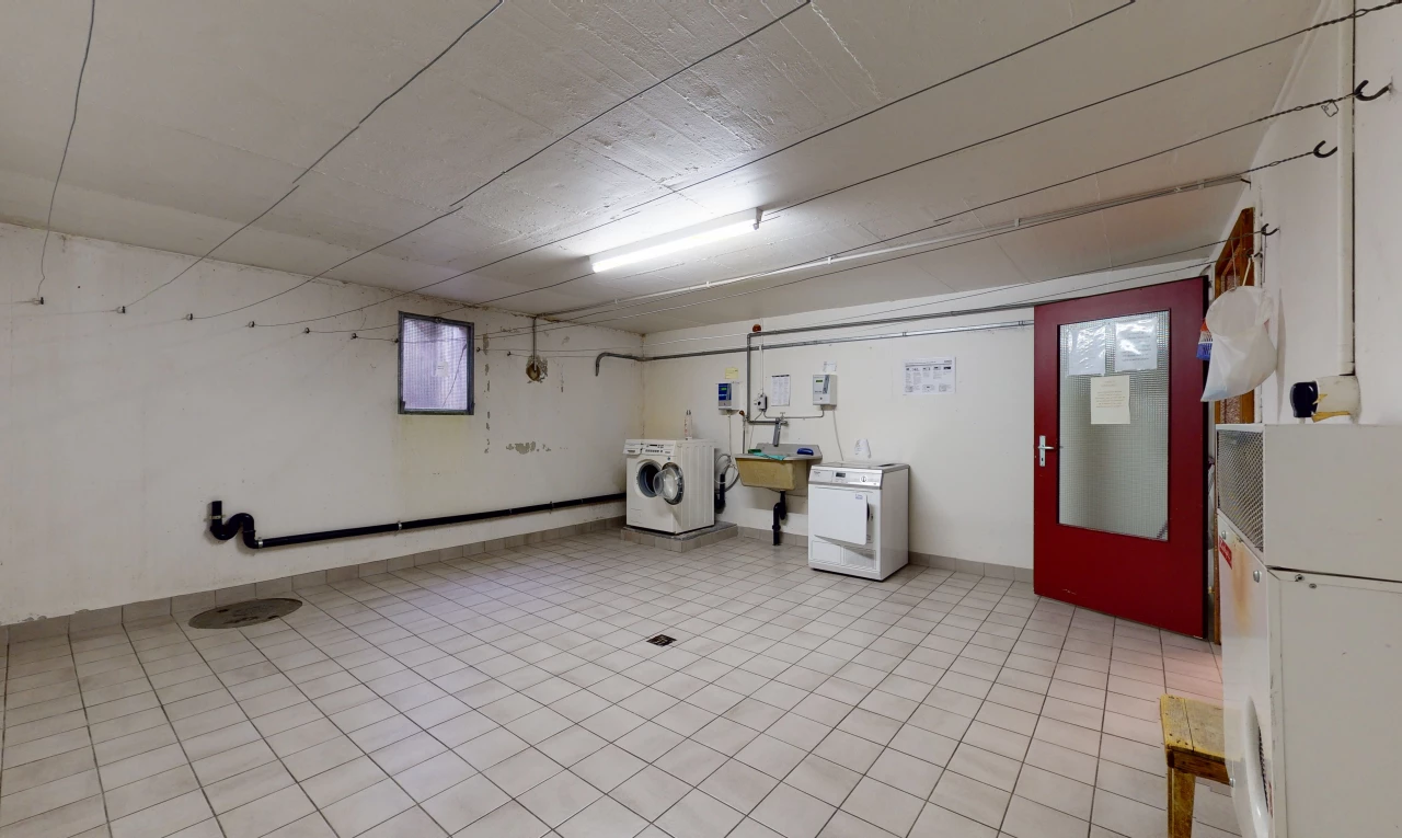 laundry area featuring tile flooring and washer / dryer