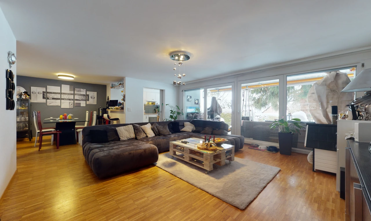 hardwood floored living room featuring natural light
