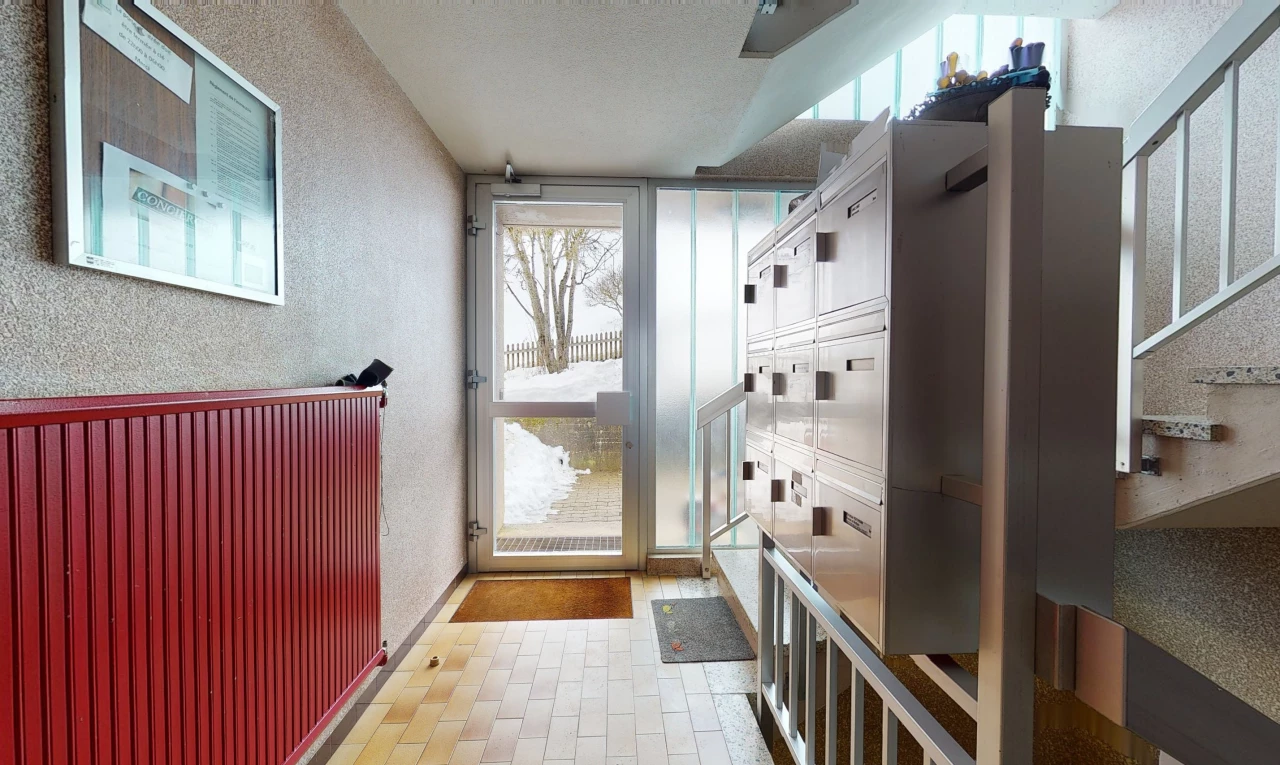 mudroom featuring natural light and tile flooring