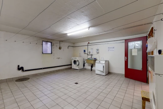 laundry area featuring tile flooring and washer / dryer