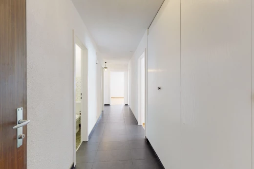 hallway featuring tile floors