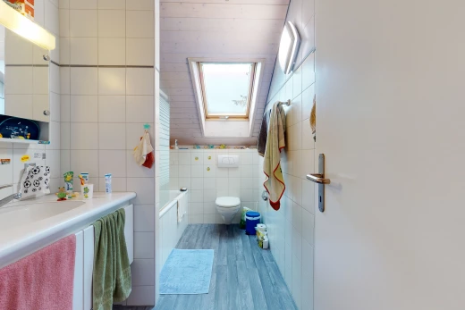 half bathroom featuring toilet, mirror, and vanity