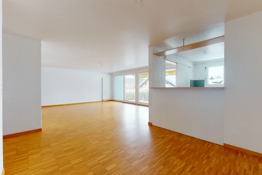 wood floored spare room with natural light