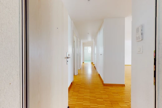 corridor with hardwood floors
