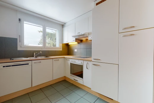 kitchen with natural light, oven, ventilation hood, electric stovetop, dishwasher, light countertops, white cabinetry, and light tile floors