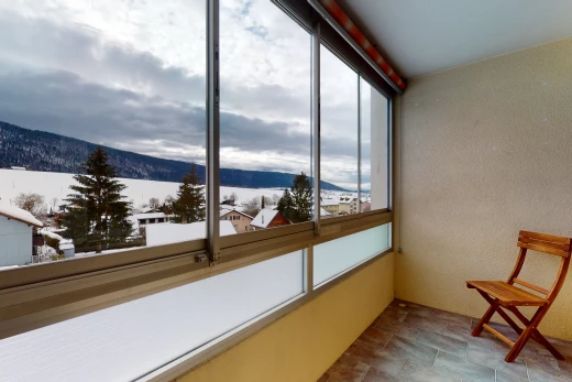 sunroom / solarium featuring a healthy amount of sunlight