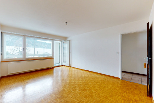 chambre vide avec carrelage, lumière naturelle, et radiateur