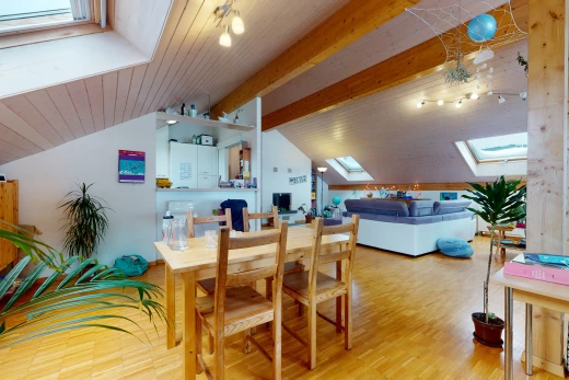 dining area with natural light, lofted ceiling with skylight, and hardwood floors