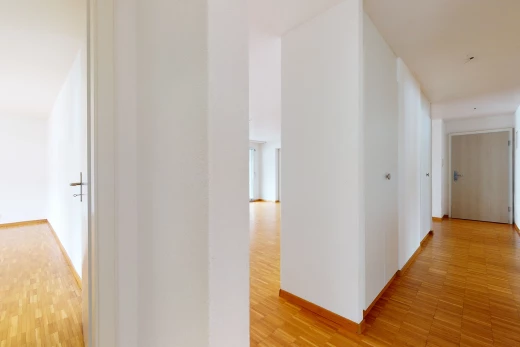 hallway with hardwood flooring