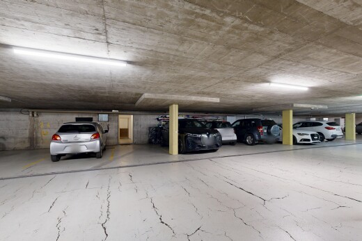 view of parking featuring a parking deck