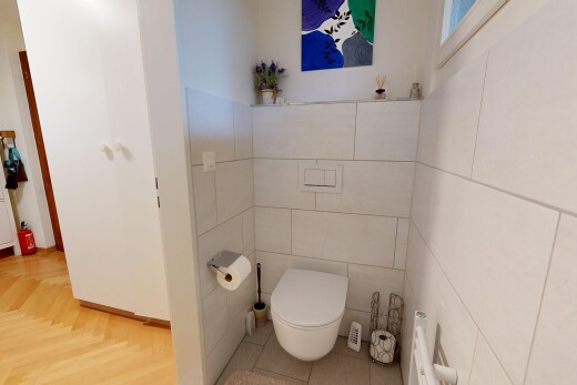 bathroom with tile walls