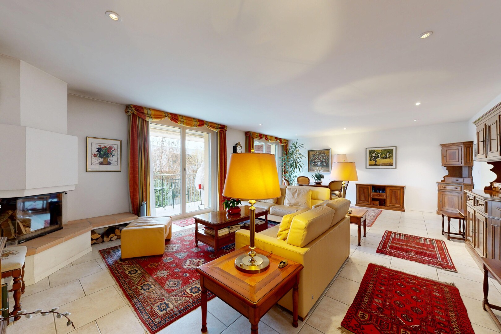 living room featuring recessed lighting, light tile patterned flooring, and a fireplace