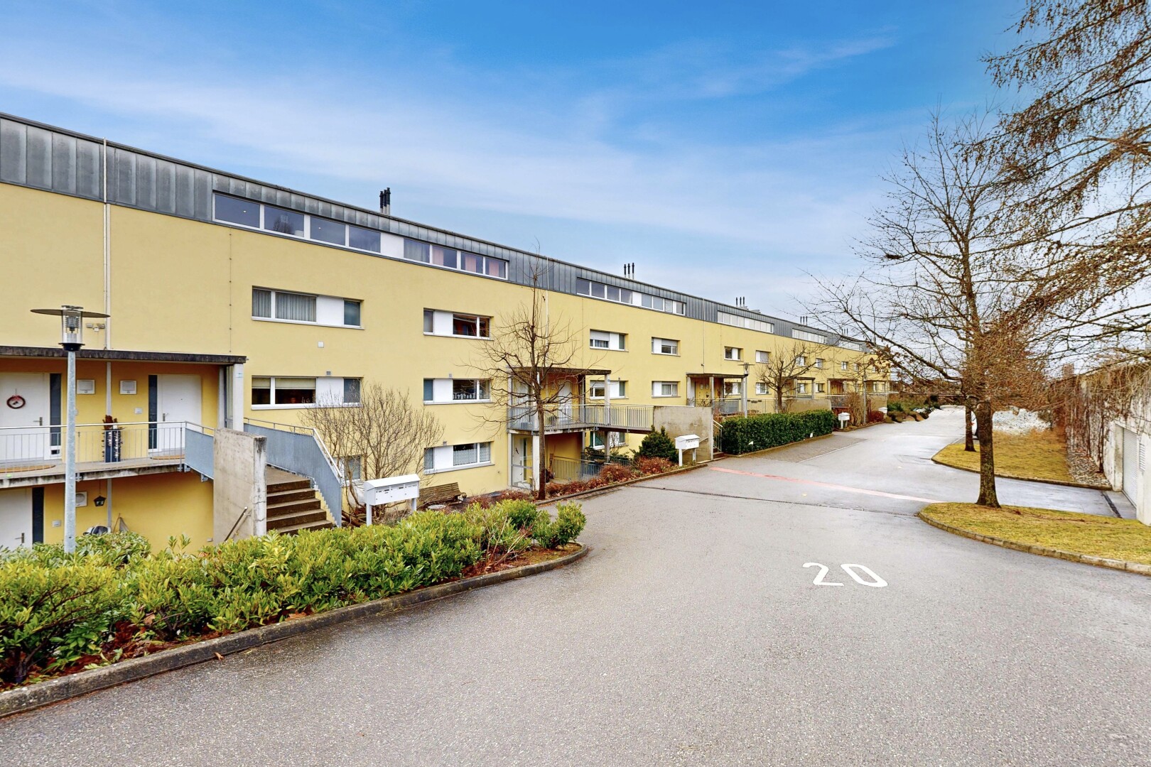 view of apartment building / complex with stairs