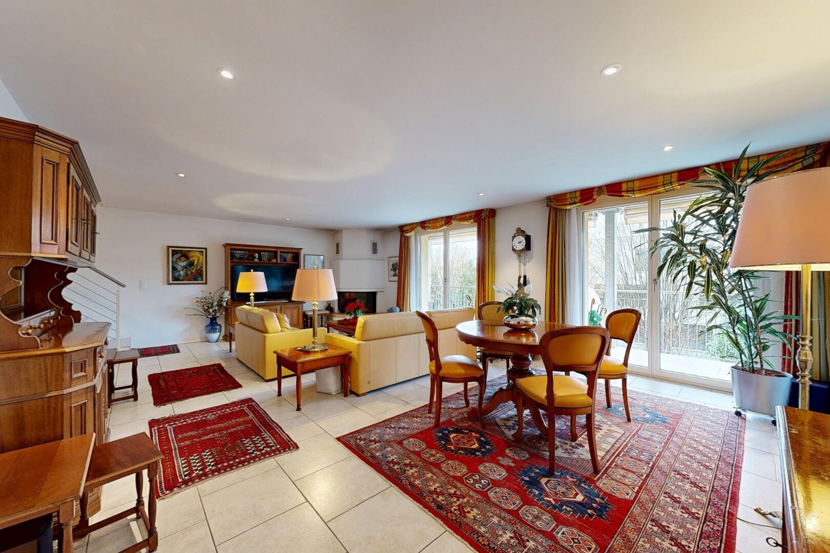 living / dining room featuring light tile patterned floors and recessed lighting