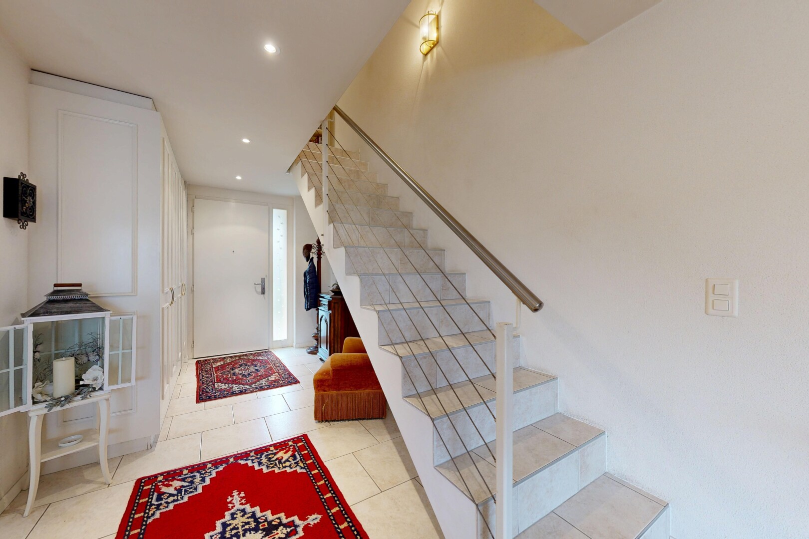 staircase featuring recessed lighting and tile patterned flooring