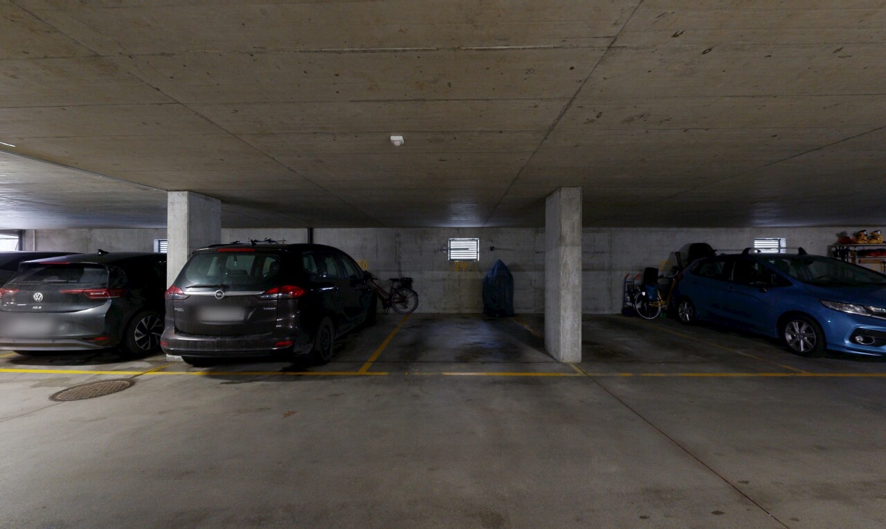 view of parking with a parking deck