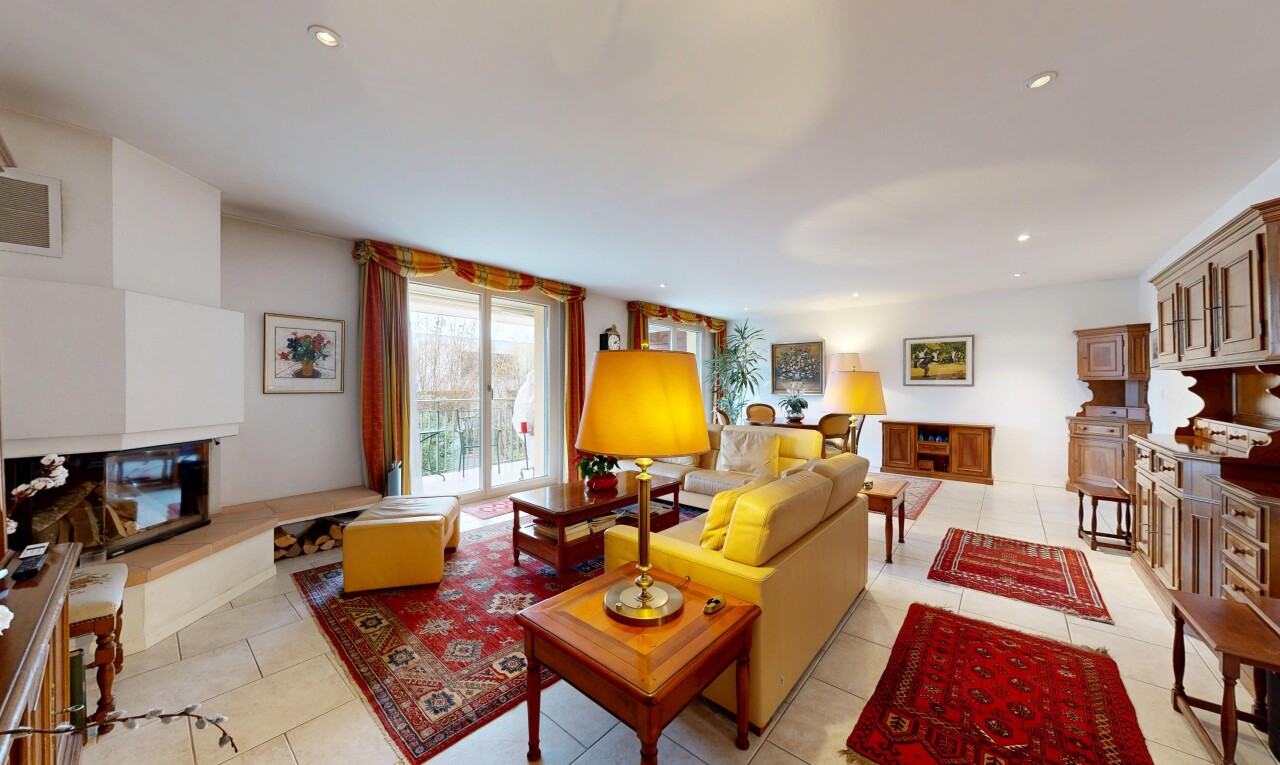 living room featuring recessed lighting, light tile patterned flooring, and a fireplace