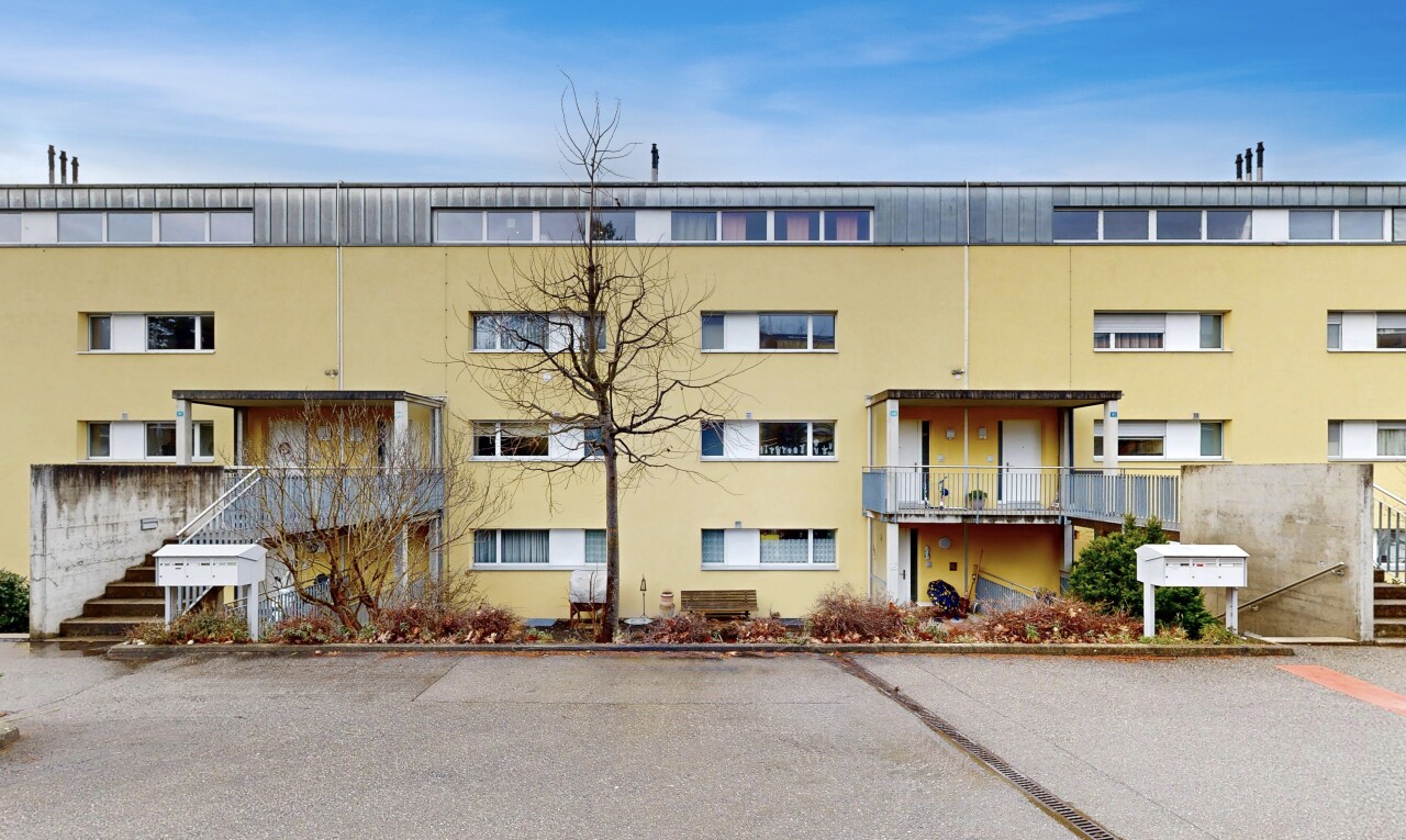 view of apartment building / complex featuring stairway