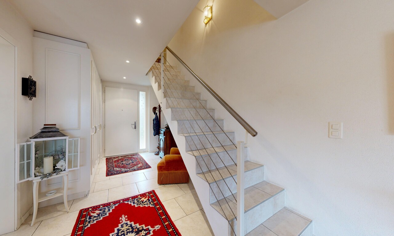 staircase featuring recessed lighting and tile patterned flooring
