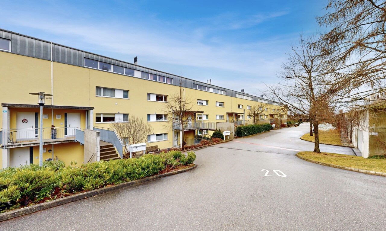 view of apartment building / complex with stairs