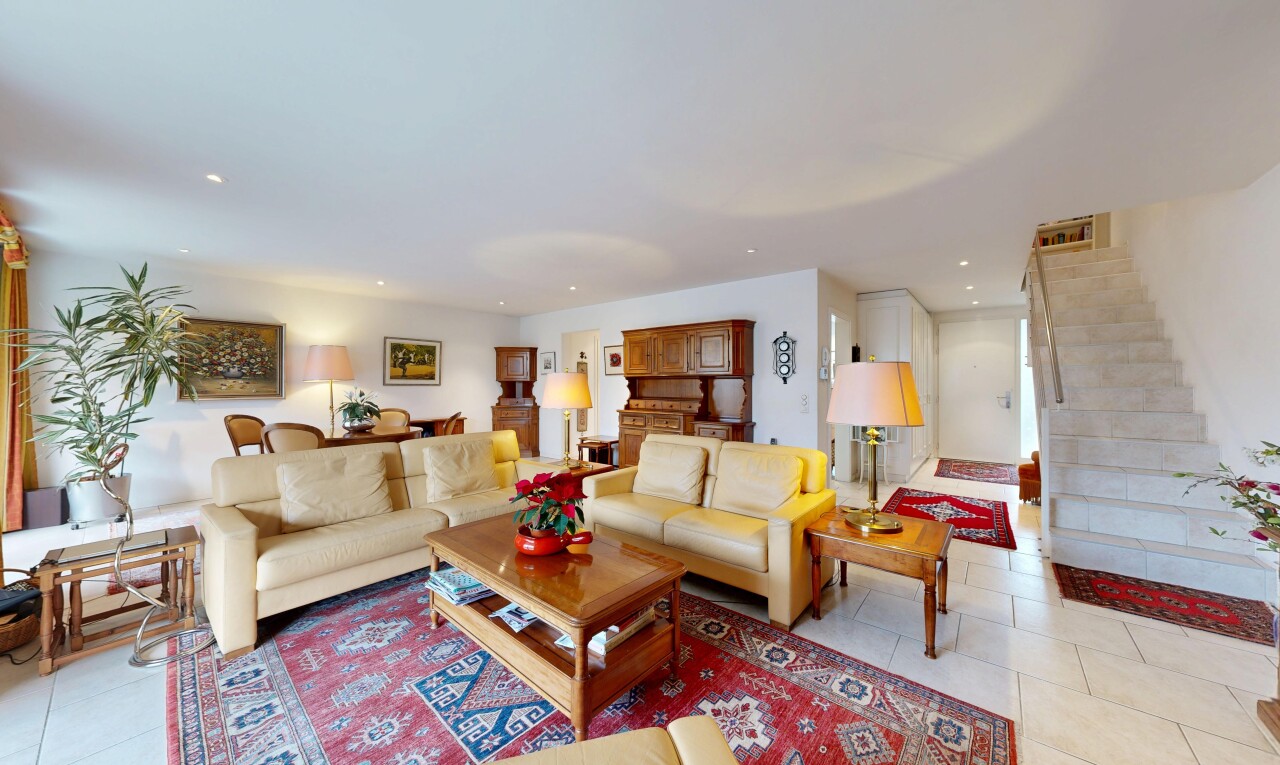 living area featuring light tile patterned floors and recessed lighting