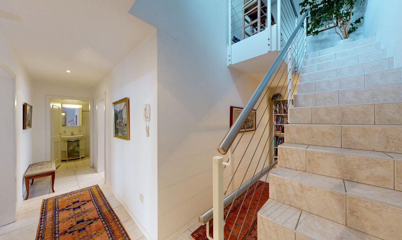 stairs featuring tile patterned flooring